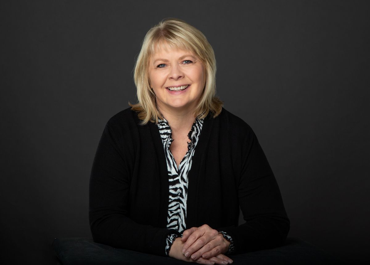 Portrait of Holly Holt, Executive Vice President at Merit Solutions